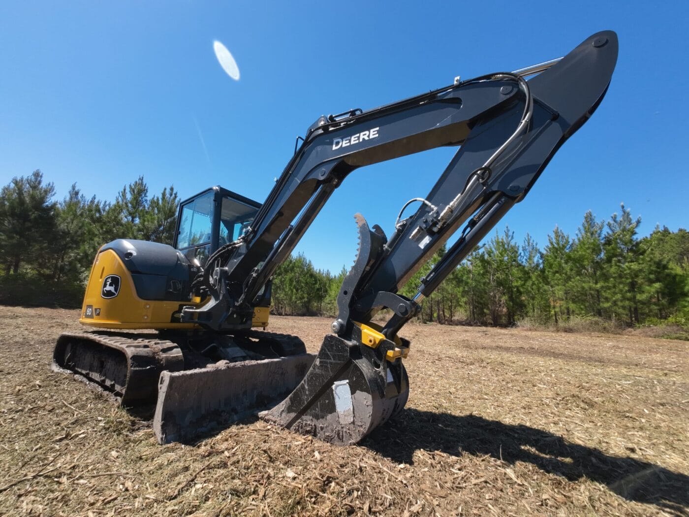 Excavator in field